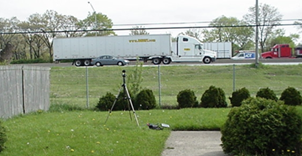 Title: Roadway on a fill - Description: Noise measurement near a roadway on a hill with a heavy truck passing by.