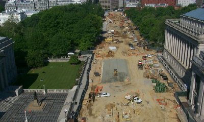 Pennsylvania Avenue from 15th to 17th Streets is being reconstructed, as shown here.  In the foreground, a statue of Albert Gallatin, a former Secretary of the Treasury (1801 to 1814), sits in front of the Treasury Building.  The top of White House is visible behind the line of trees.  (Photo courtesy Eastern Federal Lands Highway Division)