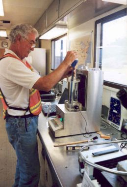 Photo of air void analyzer being prepared for testing