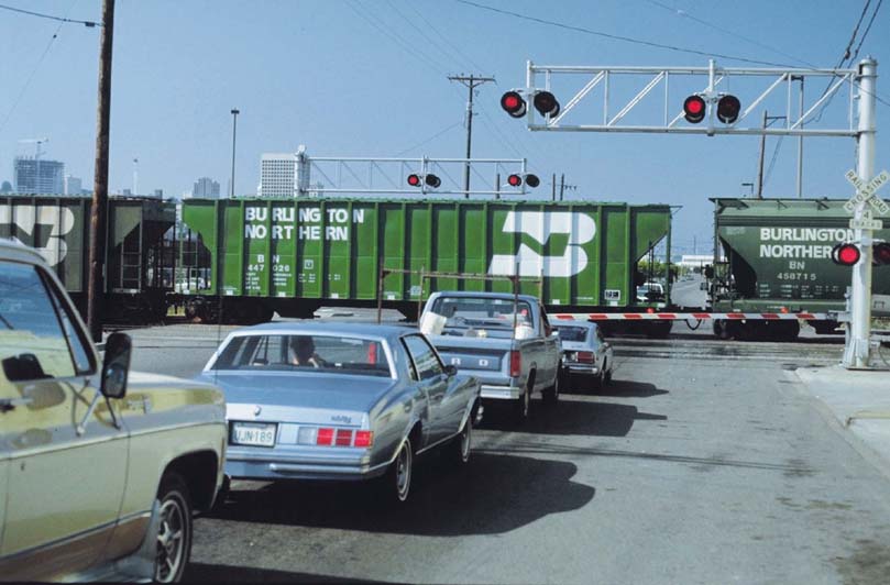 Cars halted at railroad crossing