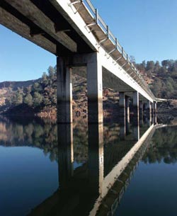 Photo. Image of a multi-lane bridge crossing a river.