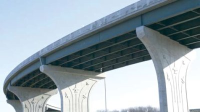 This photo shows an airplane motif grafted to the sides of pillars supporting an elevated ramp of I-75.