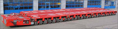Self-propelled modular transporter (SPMT) units are connected together both laterally and longitudinally for a platform that is two units wide and three units long. The wheels on the SPMT units are turned 90 degrees.