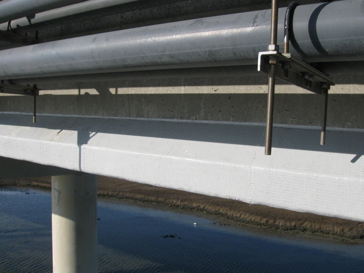 Image 3: This picture depicts prestressed concrete bridge girder rehabilitated using FRP wrap.