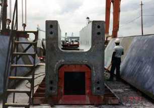 The figure is a photo of the end of the pier column used on the Edison Bridge. The photo shows the grouted reinforcing splice couplers at the base of the column.