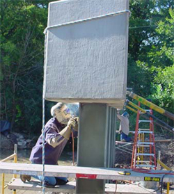 This figure is a photo of the precast pile bent cap being welded to the steel H-pile.