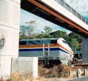 Photo: Train going under bridge