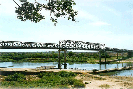 A picture of a completed Mabey Johnson-type bridge spanning a river.