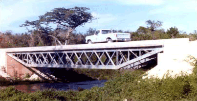Picture showing a completed steel Under-slung Truss Bridge in Belize, Central America.