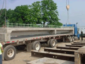 Picture showing a unit of the cold formed steel box bridge system on the truck ready to be lifted by the construction cranes.