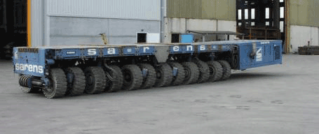 Picture showing the rotation of the tires of the self-propelled modular transporter systems to allow movement of the transported bridge unit in any desired direction.