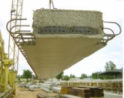 Poutre Dalle (precast, prestressed inverted-T deck panel) span with the looped reinforcement at the joint is being moved from the casting bed in France (Photo Courtesy Central Laboratory for Public Works)