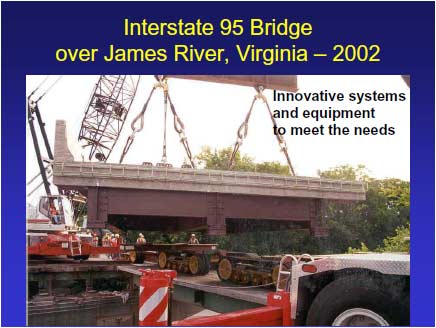 I-95 Bridge during superstructure replacement. A superstructure segment is being suspended by cranes prior to being lowered onto existing supports. The segment is composed of three steel girders with partial-depth end diaframs and composite concrete deck, complete with traffic railing.