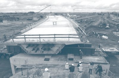 Photograph showing SPMTs moving a bridge crossing Amsterdam's A4/A5expressway to final location.
