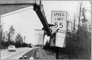 Photo: Signs go up as the speed limit comes down.