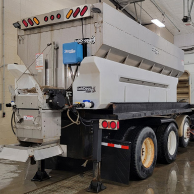 A picture containing truck, trailer, trash