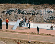 construction team installing a segment of insulated pavement