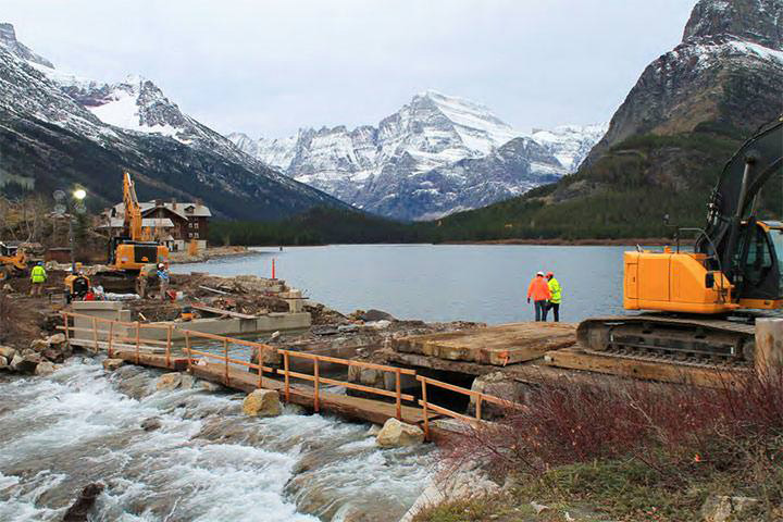 Repair and rebuilding of Swiftcurrent Bridge while retaining the crossing's historical integrity by integrating a stone masonry veneer and recreating the historic style of the bridge's pedestrian rail.