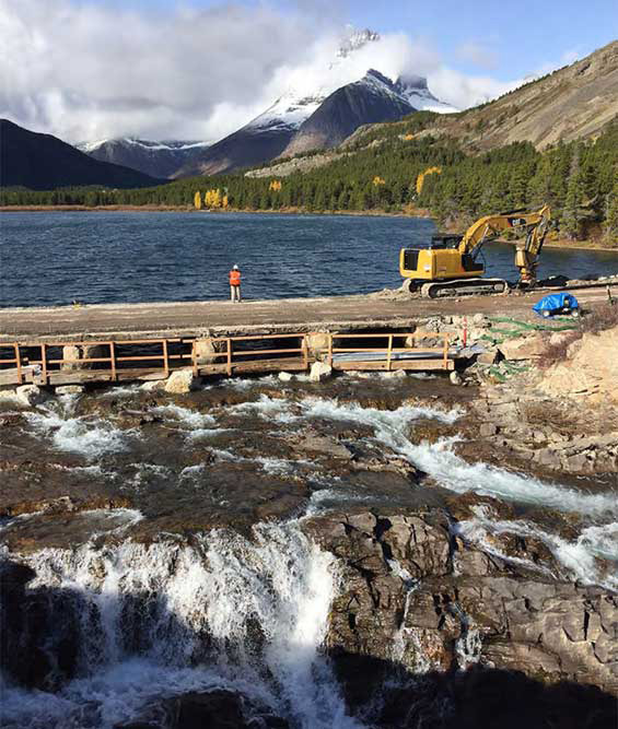 Repair and rebuilding of Swiftcurrent Bridge while retaining the crossing's historical integrity by integrating a stone masonry veneer and recreating the historic style of the bridge's pedestrian rail.