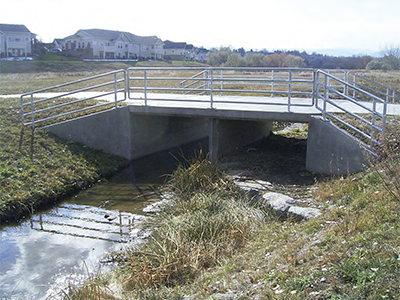 Figure 3-21: Multi-cell box culvert This image shows the concept of a multi-cell box culvert, which places one cell floor lower than the other to keep normal channel flows and discharge confined to one cell.