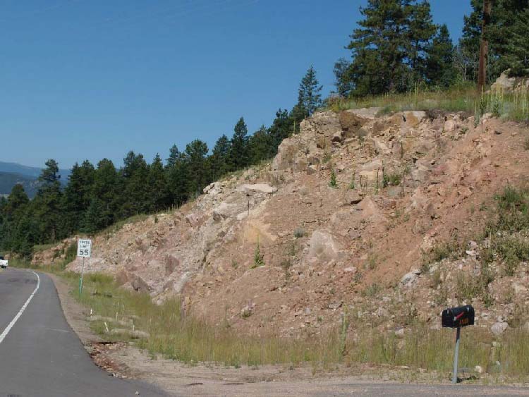 Figure 14. Photo. Final configuration of a cushion-blasted slope in granitic rock.