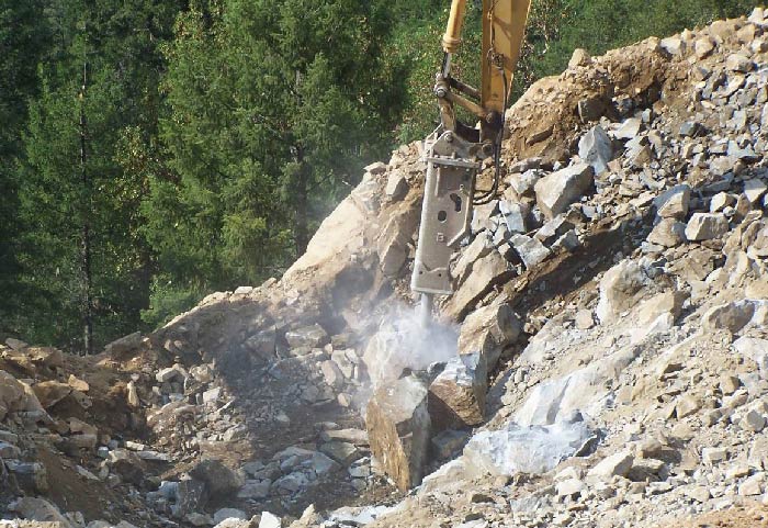 Photo. Application of a hydraulic hammer attached to an excavator.