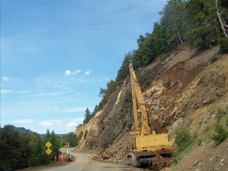 Photo. Slope rounding using long-reach excavator, Hyampom Road, California.