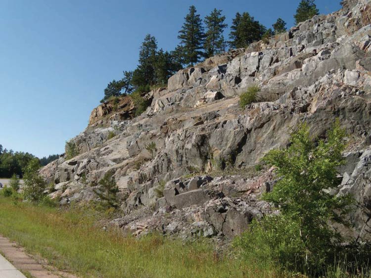 Photo. Rock slope excavated using slope variation and sculpting techniques.