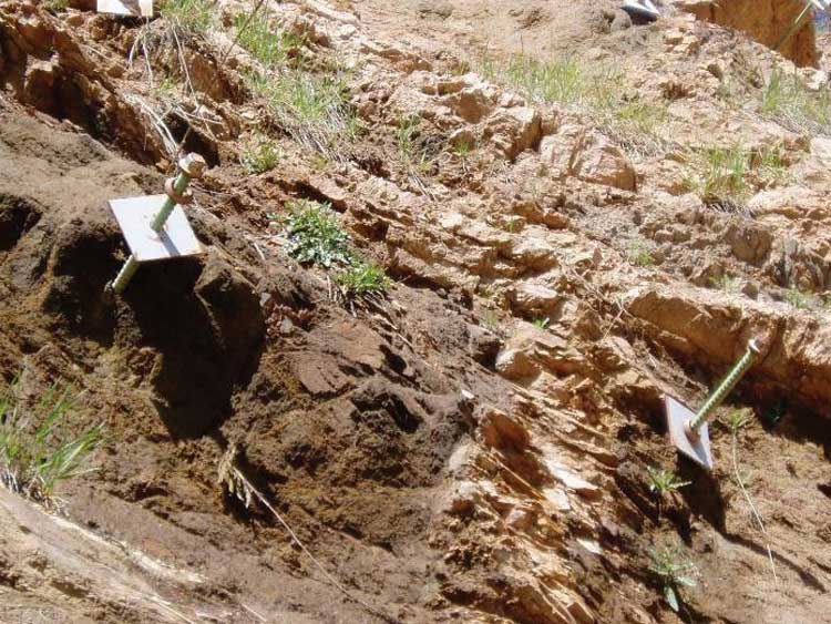 Figure 45. Photo. Rock bolts installed in an area where the surrounding rock has eroded away, reducing the effectiveness of the bolts.