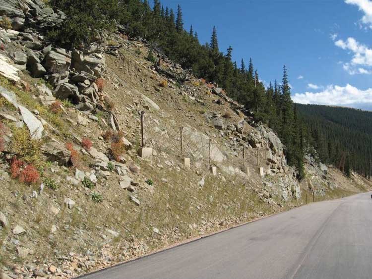 Figure 64. Photo. Installation of a flexible rockfall barrier on Guanella Pass, Colorado.