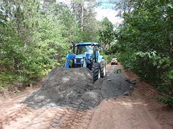 Bulldozer spreading ash.