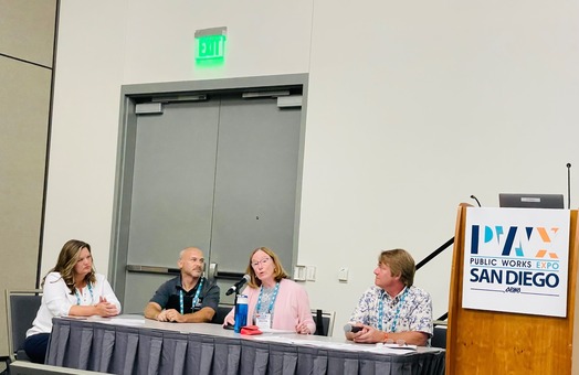 LTAP Directors speaking from a table during the PWX Expo.