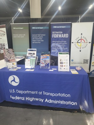 Exhibit booth with banners and handouts for the National Transportation in Indian Country Conference.
