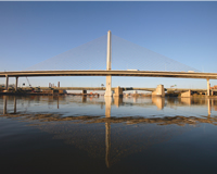 Reflecting in the Maumee River, the Veterans' Glass Skyway has changed Toledo’s skyline, while addressing I-280 vehicular and river congestion. Interstate traffic now moves freely, high above the river, unfettered by the bascule bridge.