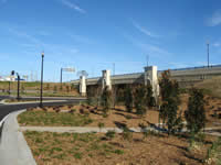 Photo of the completed Liberty Road interchange showing landscaping, decorative lighting and bridge railings, and aesthetic details on the bridge.