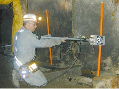 Photo of Engineer holding 80-MHz (Multiple Low Frequency) antenna