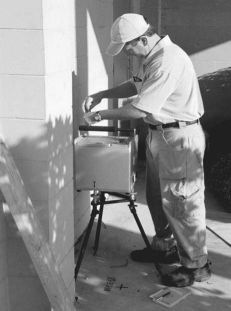 Photo of a man measuring gravity with a Scintres CG-3M gravimeter