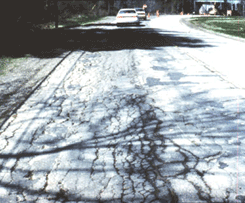 Photo of close up view of frost action type of geotechnical related pavement failure