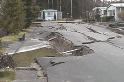 Photo of close up view of collapsing soil, karst conditions, or liquefaction type of geotechnical related pavement failure
