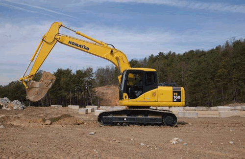 Close up photo of a track-mounted excavator (shovel) used for excavation of in-situ soil to design elevations.