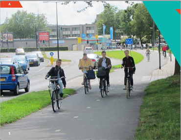 A group of 4 young adults bicycling on a separted bike lane alongside a road in Holland.