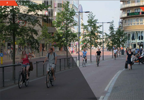 This photo shows people riding their bikes on a separated bike lane.
