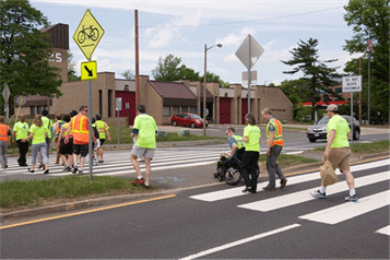Image of pedestrians in a crosswalk.