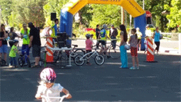 Image is of children at a bicycle event.