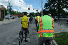 Participants bicycle during the Michigan pilot.