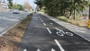 This image shows a separated, two-way bikeway from the perspective of someone standing in the bikeway.