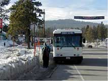 Photo of a bus stop covered by snow.