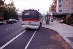 Photo of bus at bus stop.