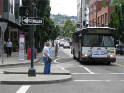 Photo of a bus approaching an intersection.