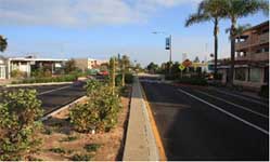 Photo of a road with a median.
